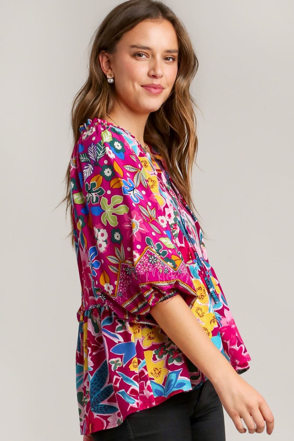 Chic floral print tie-neck peplum blouse with a flattering silhouette, perfect for a feminine and stylish look.