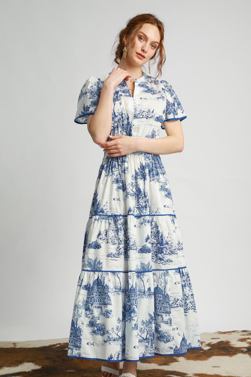 Boho-style landscape print tiered maxi dress with short sleeves, perfect for a breezy and elegant look.