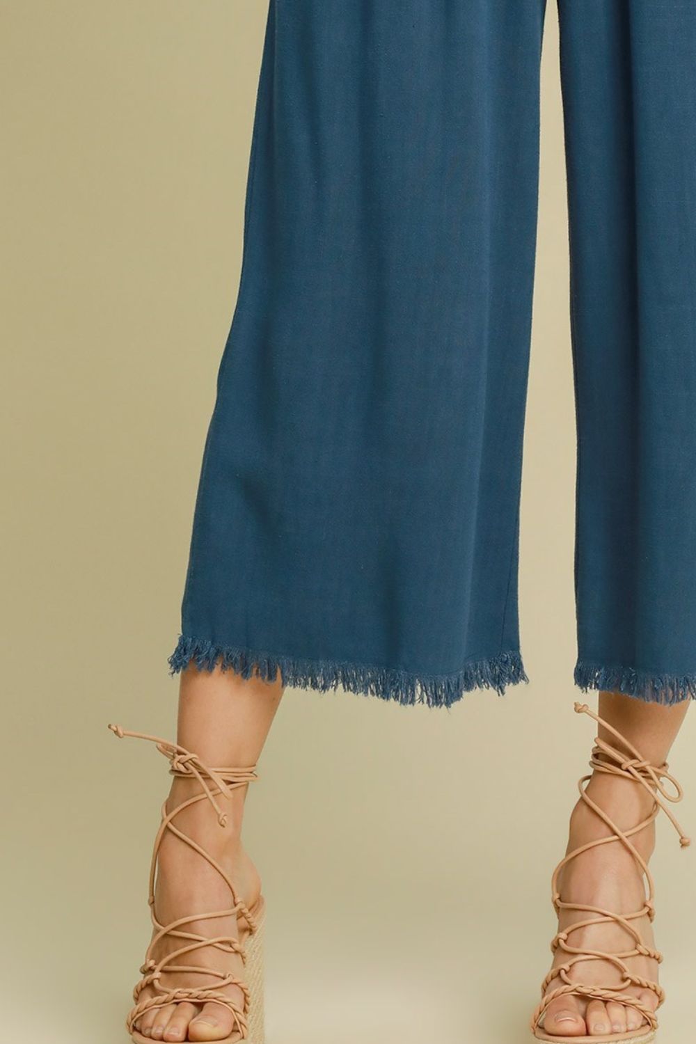 Breathable linen blend wide-leg pants with an elastic waistband and raw hem for a relaxed yet stylish look.