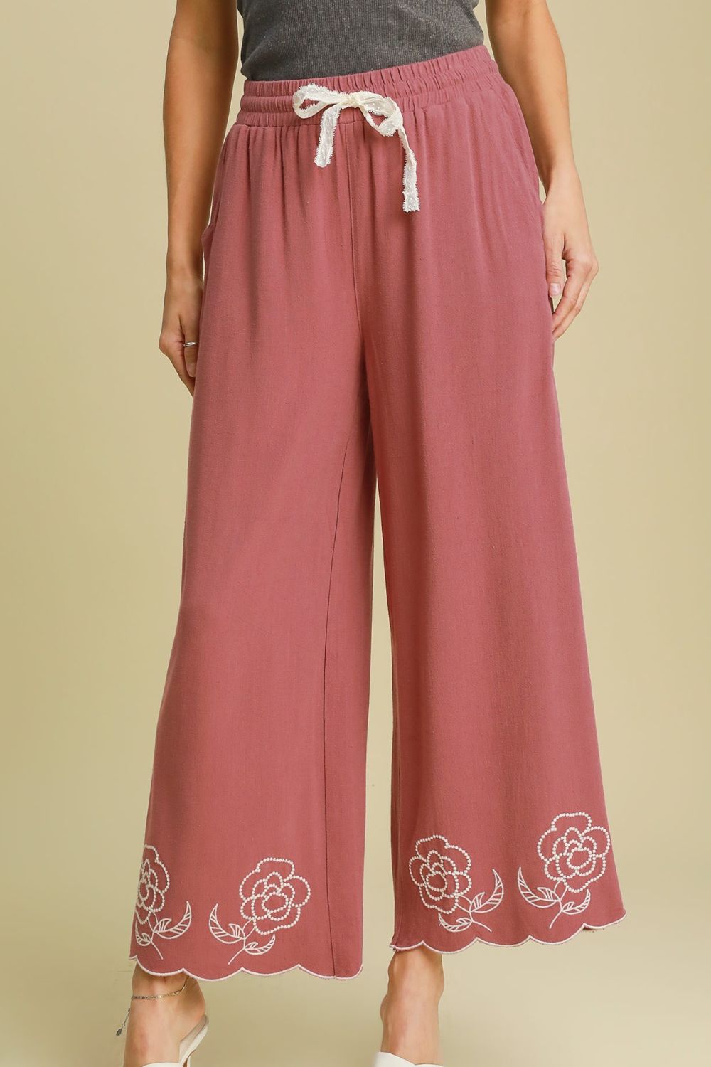 Stylish linen blend wide-leg pants with a chic scalloped hemline, drawstring waist, and pockets for an effortless and breezy look.