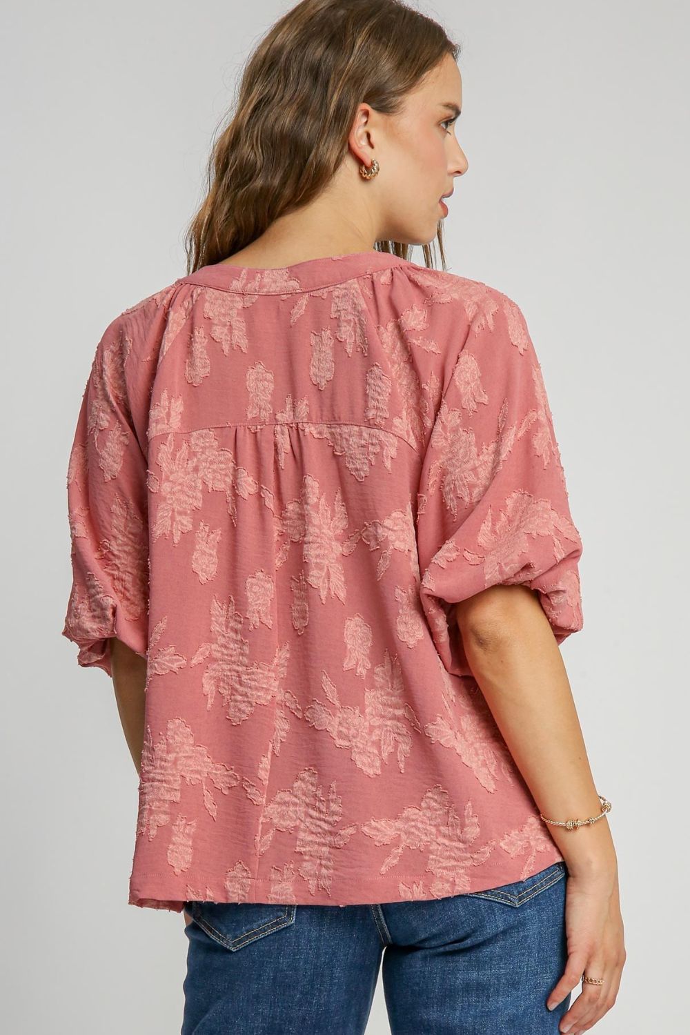 Elegant notched button detail blouse with half sleeves, perfect for a chic and versatile look.