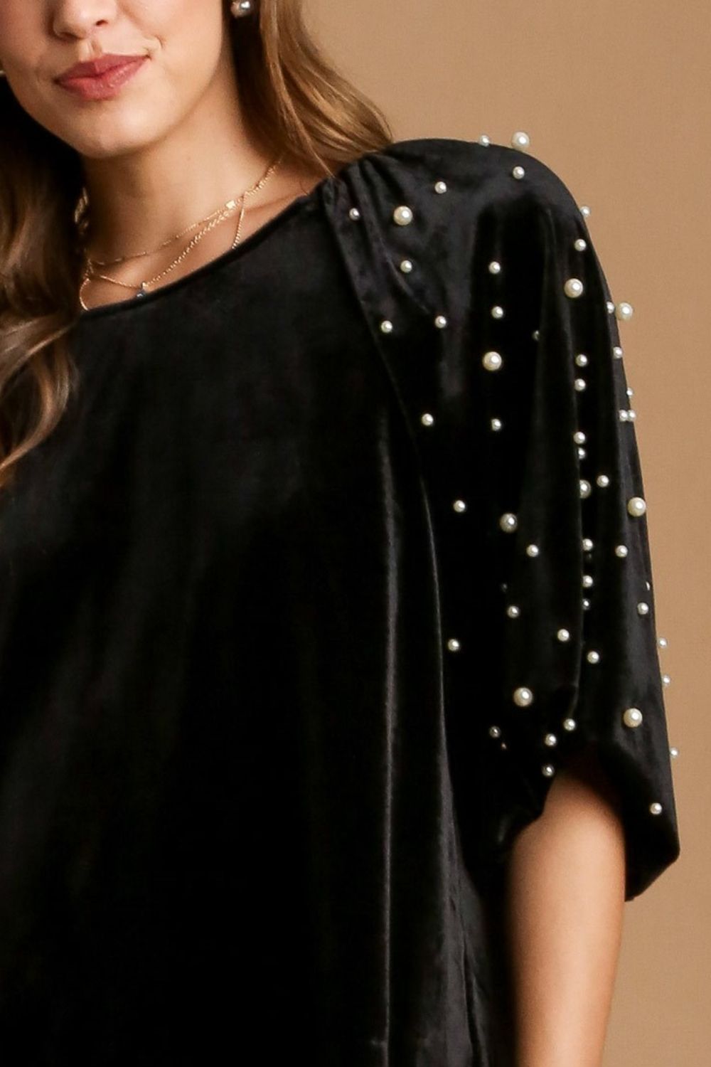 Elegant full-size velvet round neck top with pearl embellishments on the sleeves, perfect for a sophisticated look.