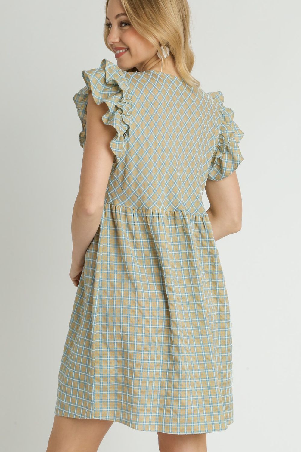 Charming plaid V-neck dress with ruffle cap sleeves, perfect for a feminine and timeless look.