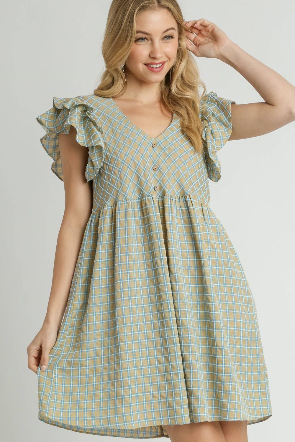 Charming plaid V-neck dress with ruffle cap sleeves, perfect for a feminine and timeless look.