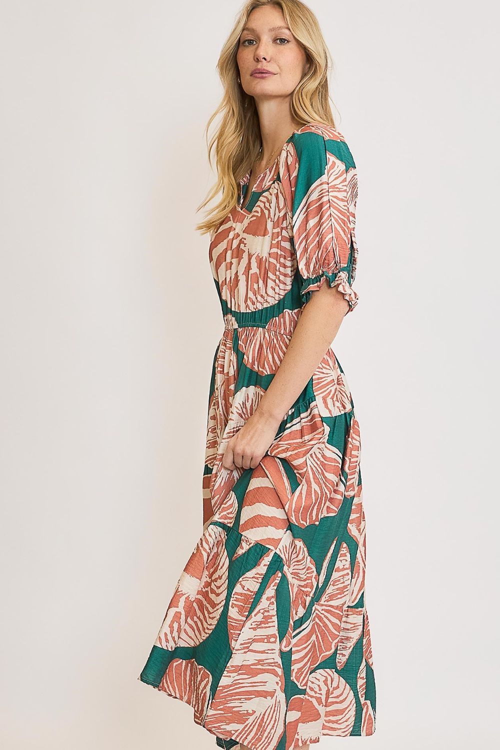 Printed midi dress with notched neckline, puff sleeves, and ruffle details—perfect for a chic and flattering plus-size look.