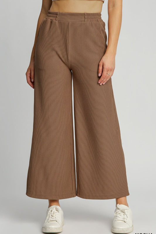 Ribbed knit wide leg pants with elastic waistband and pockets, perfect for cozy and stylish plus-size outfits.