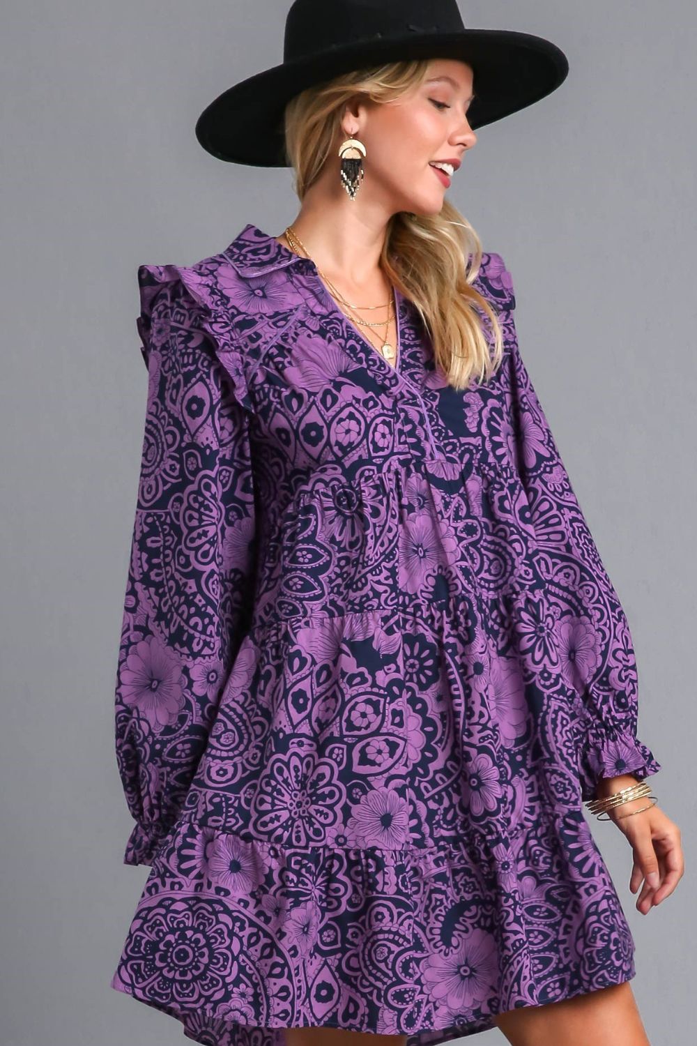 Elegant long sleeve dress with ruffled details, piping accents, and a stylish printed design, perfect for any occasion.