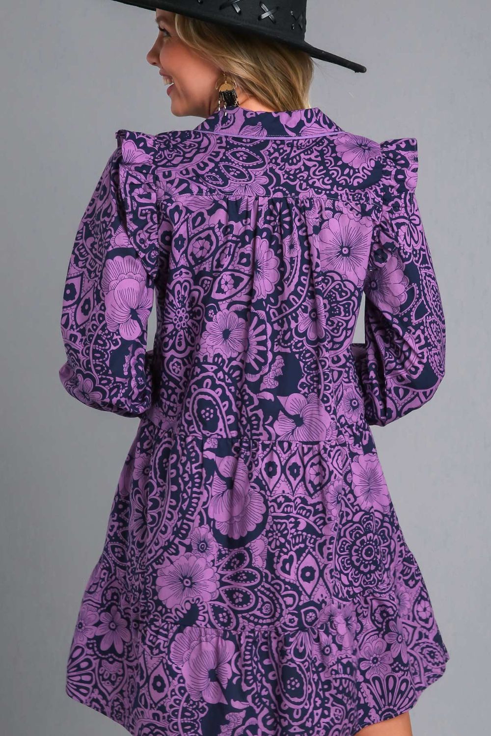 Elegant long sleeve dress with ruffled details, piping accents, and a stylish printed design, perfect for any occasion.