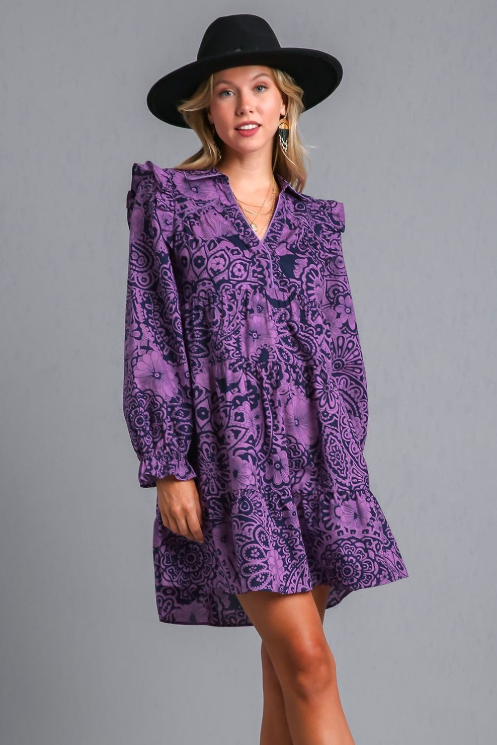 Elegant long sleeve dress with ruffled details, piping accents, and a stylish printed design, perfect for any occasion.