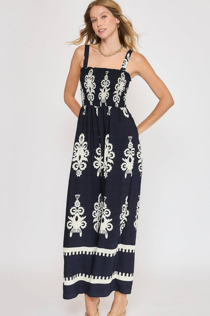 Smocked printed wide-leg jumpsuit with a flattering fit and breezy silhouette, perfect for plus-size summer styling.