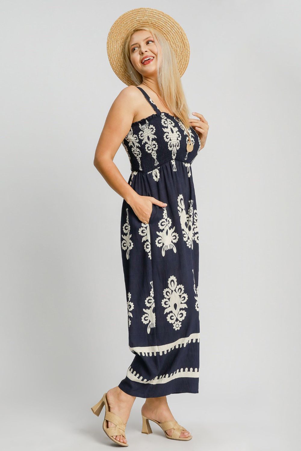 Smocked printed wide-leg jumpsuit with a flattering fit and breezy silhouette, perfect for plus-size summer styling.