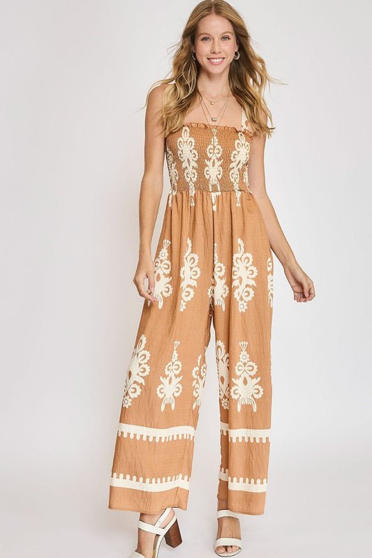 Trendy smocked printed wide-leg jumpsuit with a flattering fit, perfect for casual and summer styling.