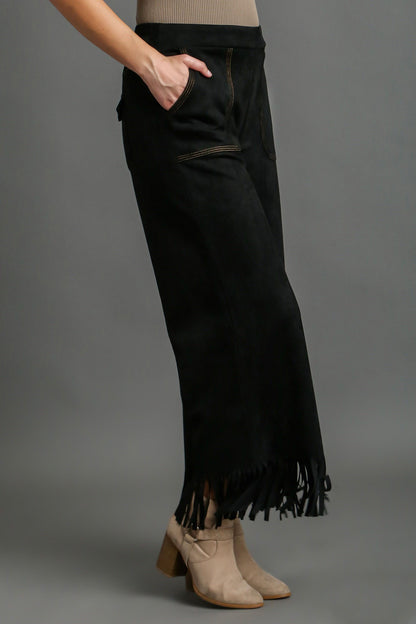 Stylish suede fringe hem wide-leg pants with a chic bohemian-inspired design, perfect for a statement look.