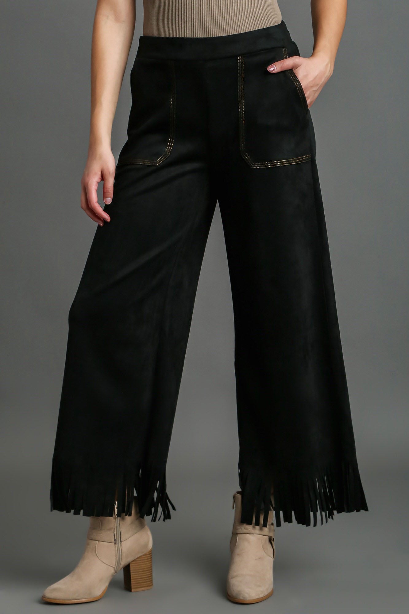 Stylish suede fringe hem wide-leg pants with a chic bohemian-inspired design, perfect for a statement look.