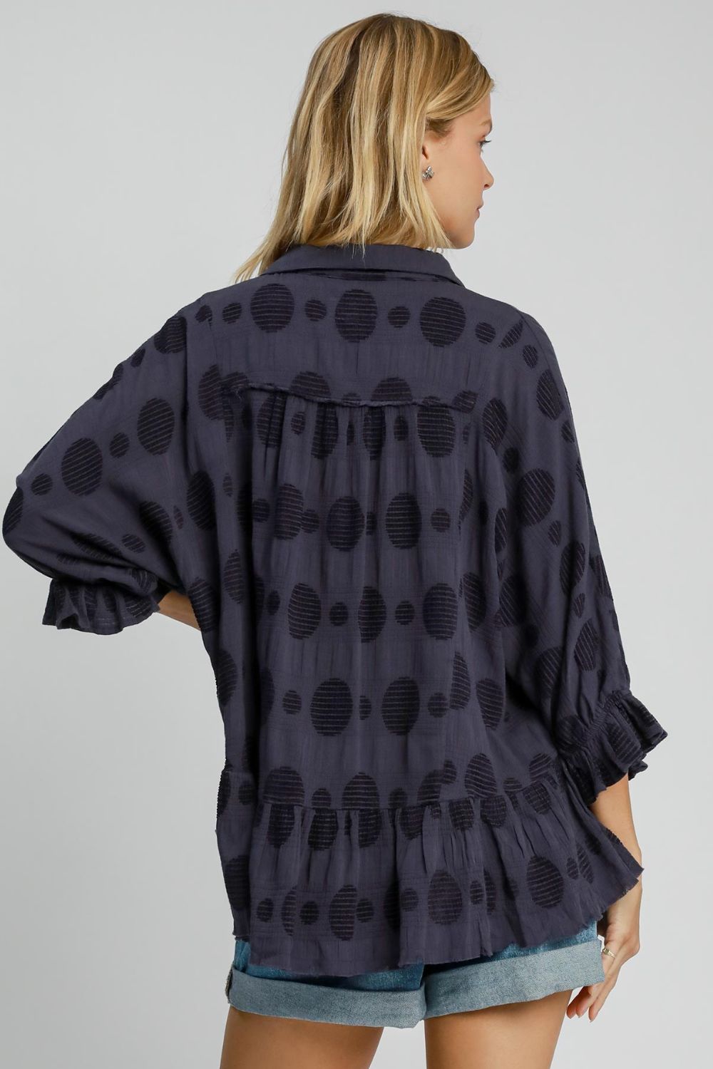 Full size Swiss dot blouse with a half-button front and flounce sleeves, crafted from breathable cotton for a chic and feminine look.