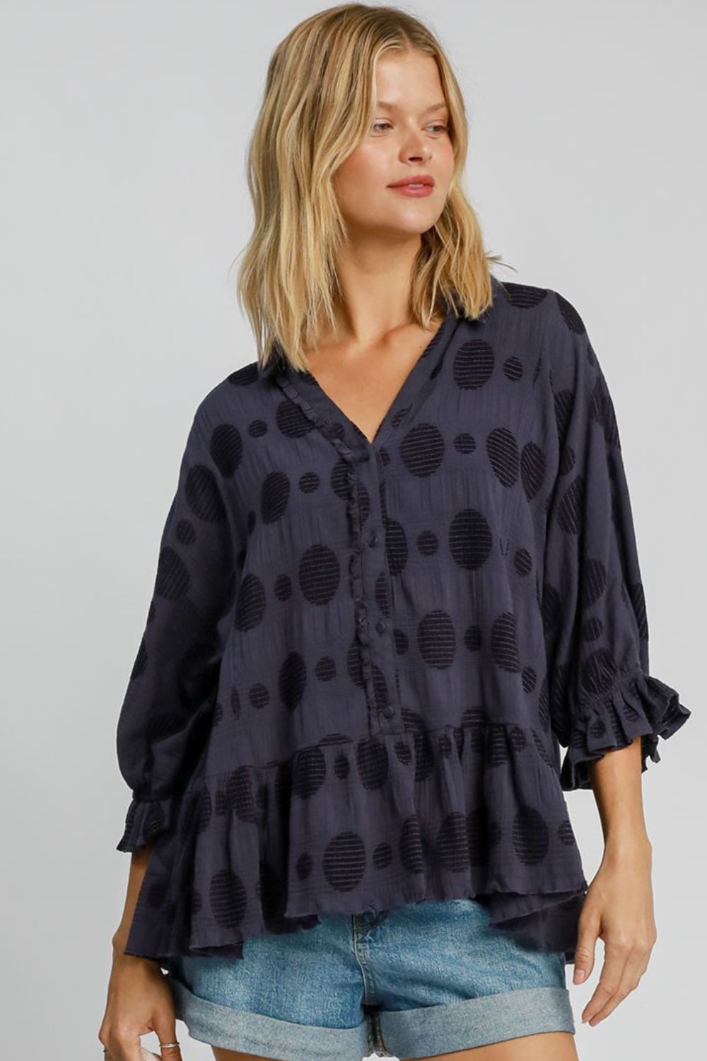 Full size Swiss dot blouse with a half-button front and flounce sleeves, crafted from breathable cotton for a chic and feminine look.