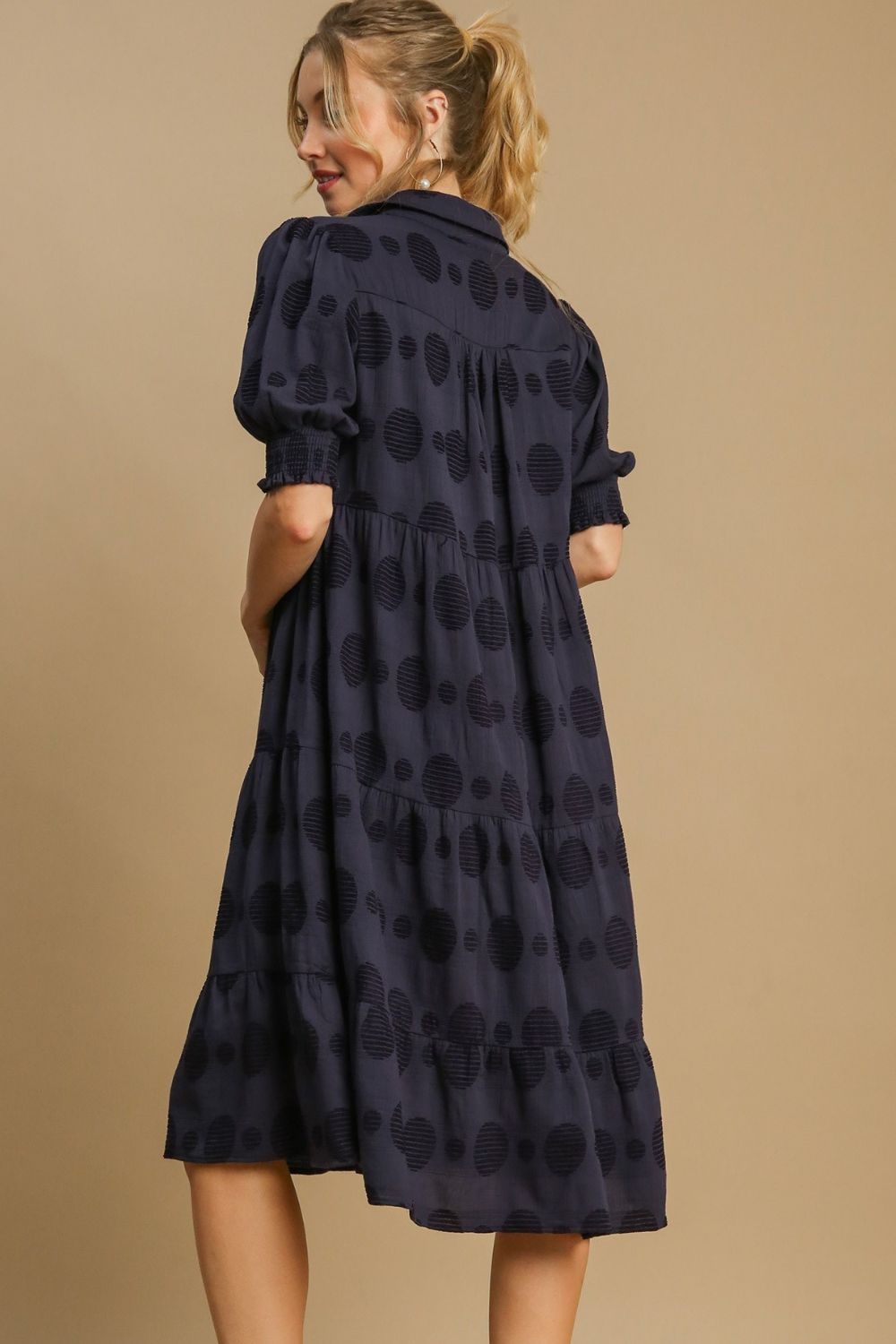 Chic Swiss dot jacquard tiered midi dress with a flowy silhouette, perfect for elegant and timeless styling.