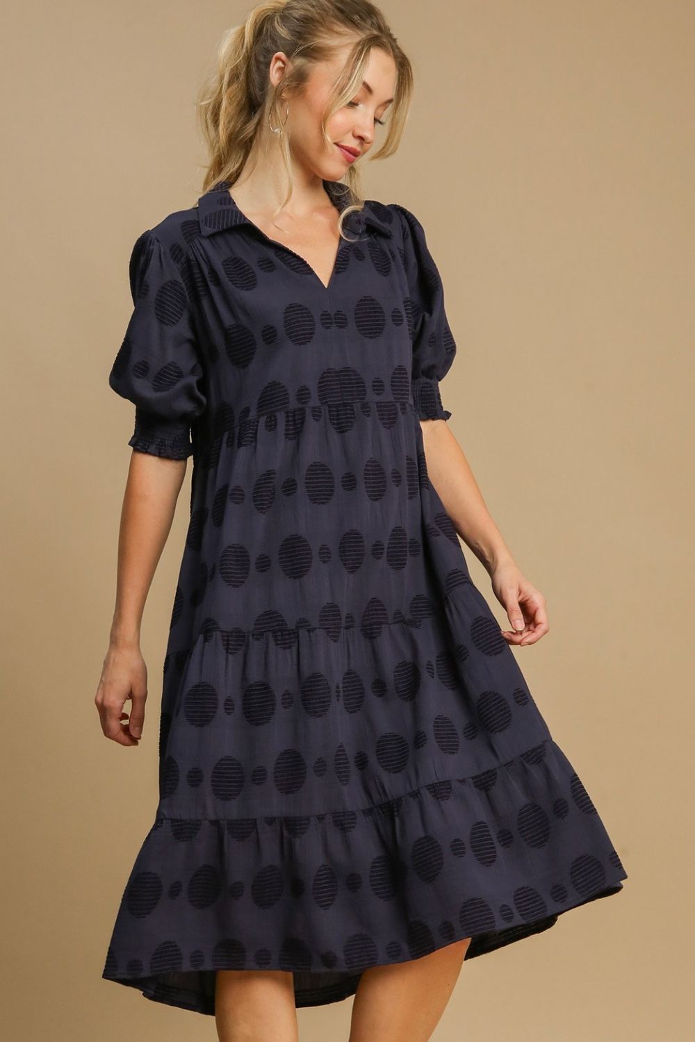 Chic Swiss dot jacquard tiered midi dress with a flowy silhouette, perfect for elegant and timeless styling.