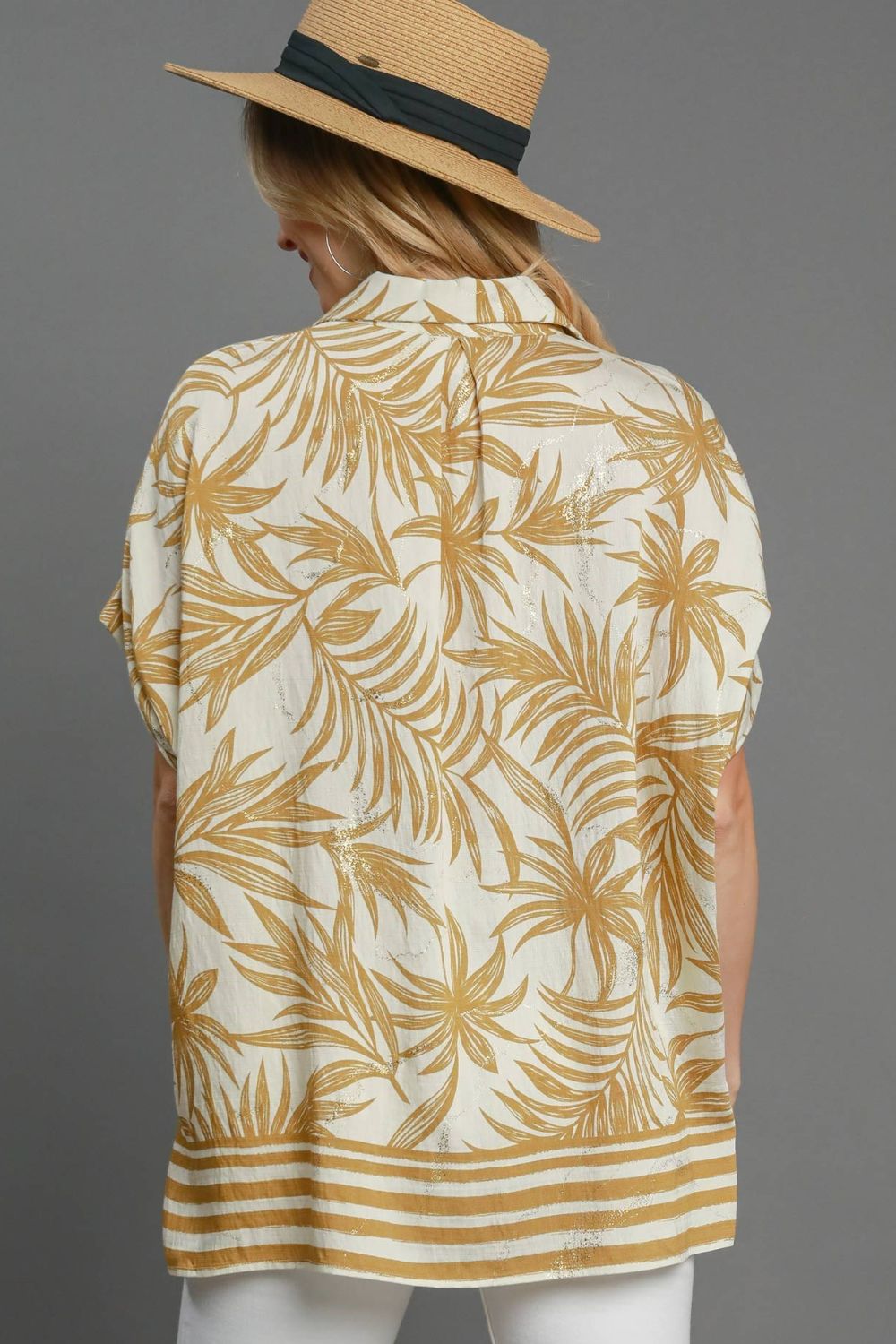 Tropical print button down shirt with high-low hem and slits, perfect for a breezy, colorful plus-size summer outfit.