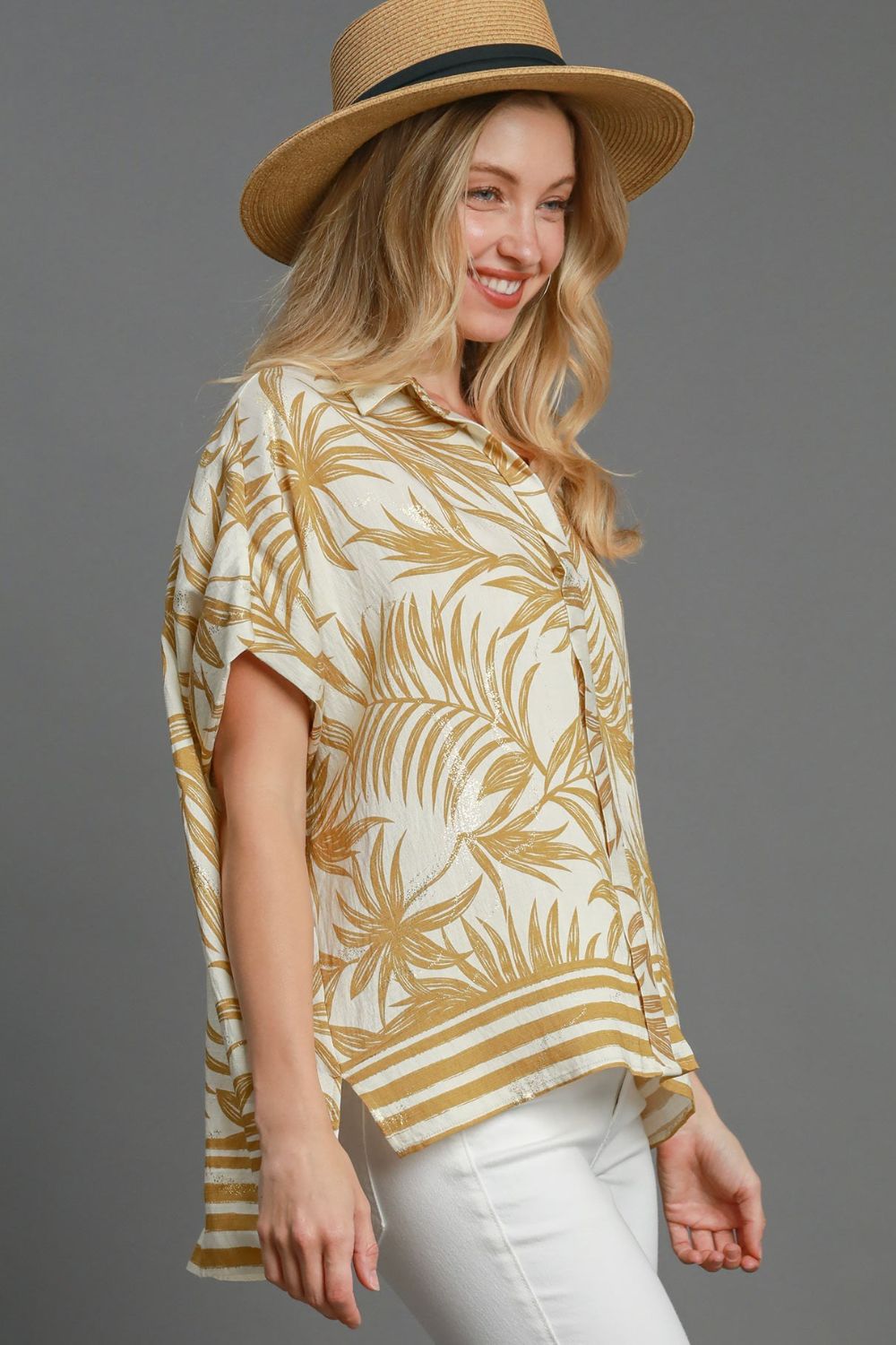 Tropical print button down shirt with high-low hem and slits, perfect for a breezy, colorful plus-size summer outfit.