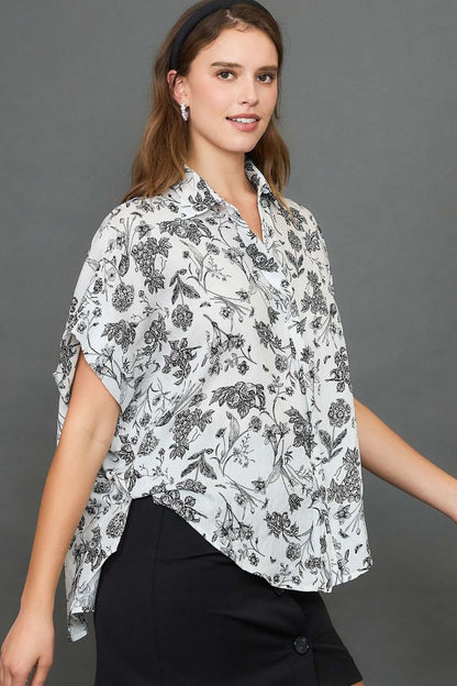 Stylish two-tone floral print top with a high-low hem, perfect for an elegant and versatile look.