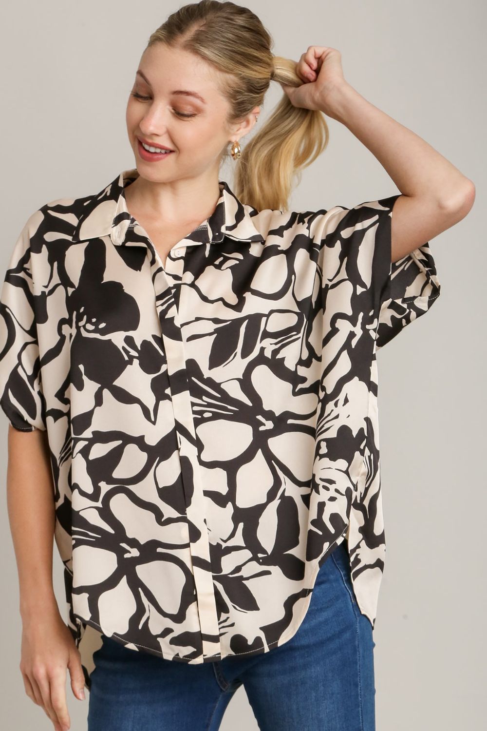 Stylish two-tone print button-down top with hidden plackets and a high-low hemline, perfect for a modern and polished look.