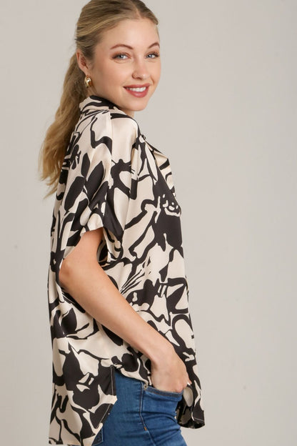 Stylish two-tone print button-down top with hidden plackets and a high-low hemline, perfect for a modern and polished look.