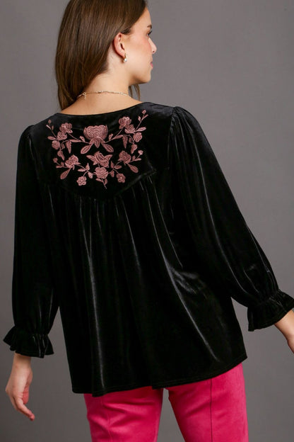 Luxurious velvet top with elegant embroidery and feminine flounce sleeves, perfect for chic and sophisticated styling.