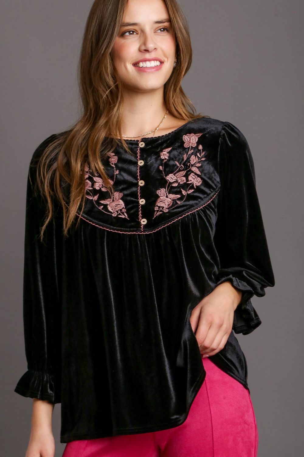 Luxurious velvet top with elegant embroidery and feminine flounce sleeves, perfect for chic and sophisticated styling.