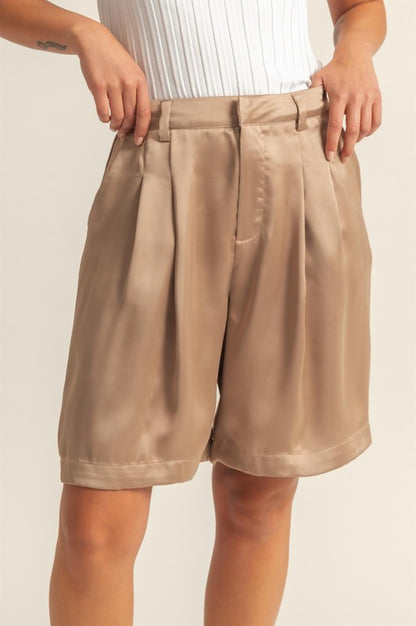 Elegant high-waist pleated satin shorts with a flattering fit and chic pleated design.