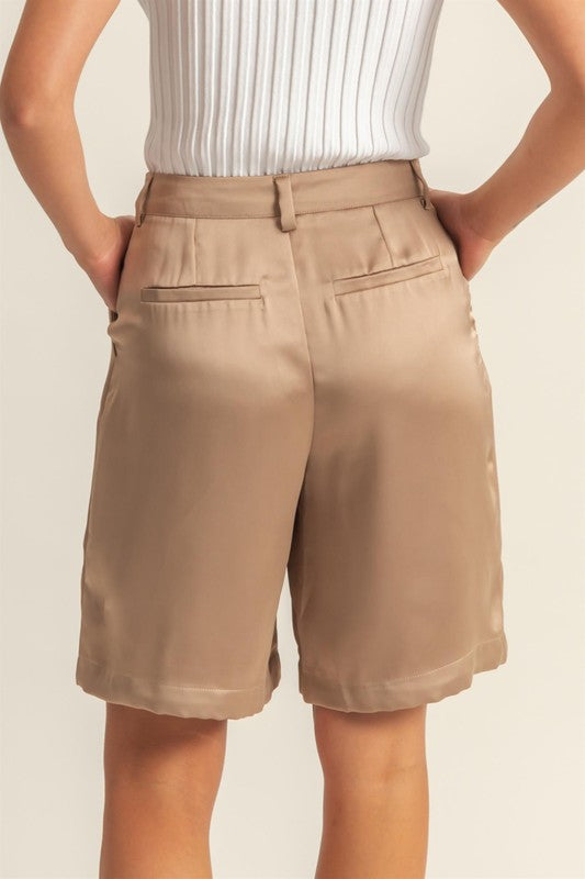 Elegant high-waist pleated satin shorts with a flattering fit and chic pleated design.