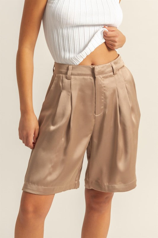 Elegant high-waist pleated satin shorts with a flattering fit and chic pleated design.