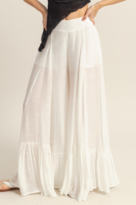 Elegant high-waist flared wide-leg pants with cascading ruffle details, perfect for both casual and formal wear.