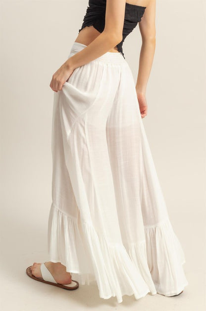 Elegant high-waist flared wide-leg pants with cascading ruffle details, perfect for both casual and formal wear.