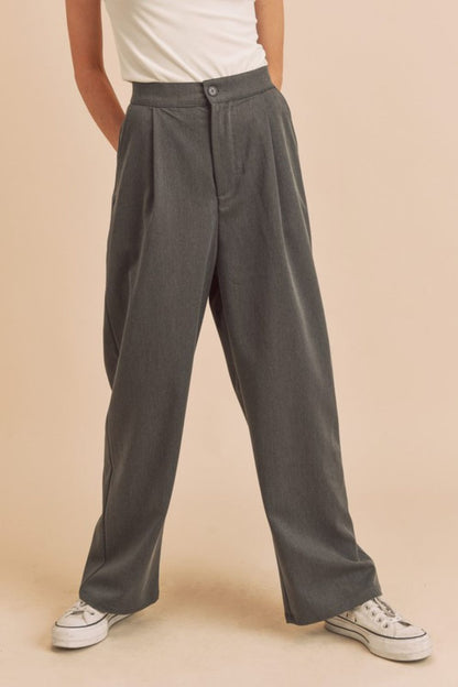 High waist wide leg pants with side pockets in a chic flowy design, offering a flattering and comfortable fit for any occasion.