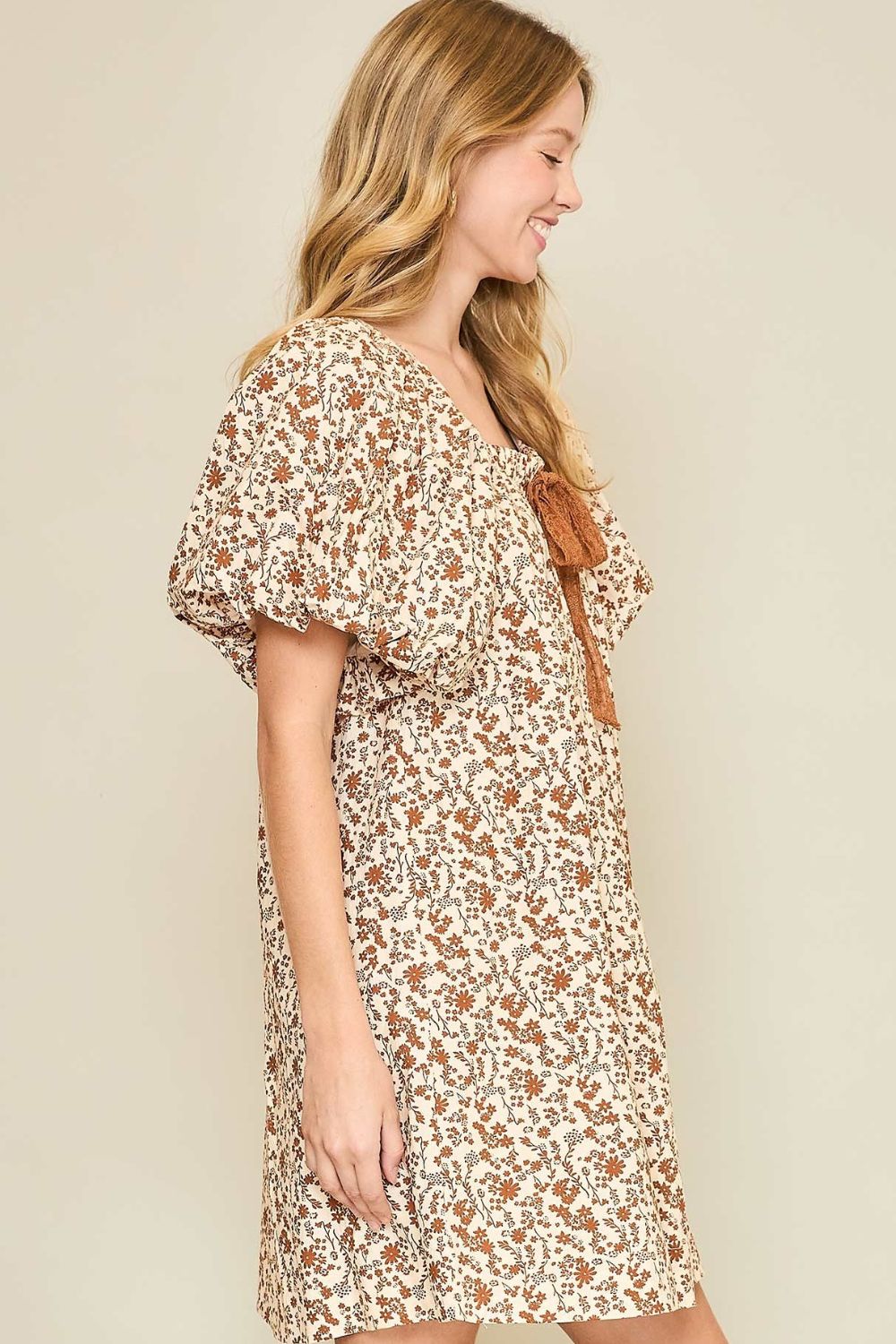 Floral print mini dress with lace tape detailing, puff sleeves, and a drawstring waist for a flattering silhouette.