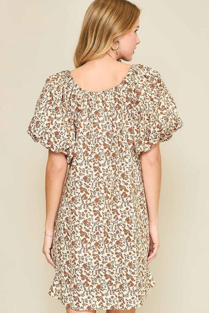 Floral print mini dress with lace tape detailing, puff sleeves, and a drawstring waist for a flattering silhouette.