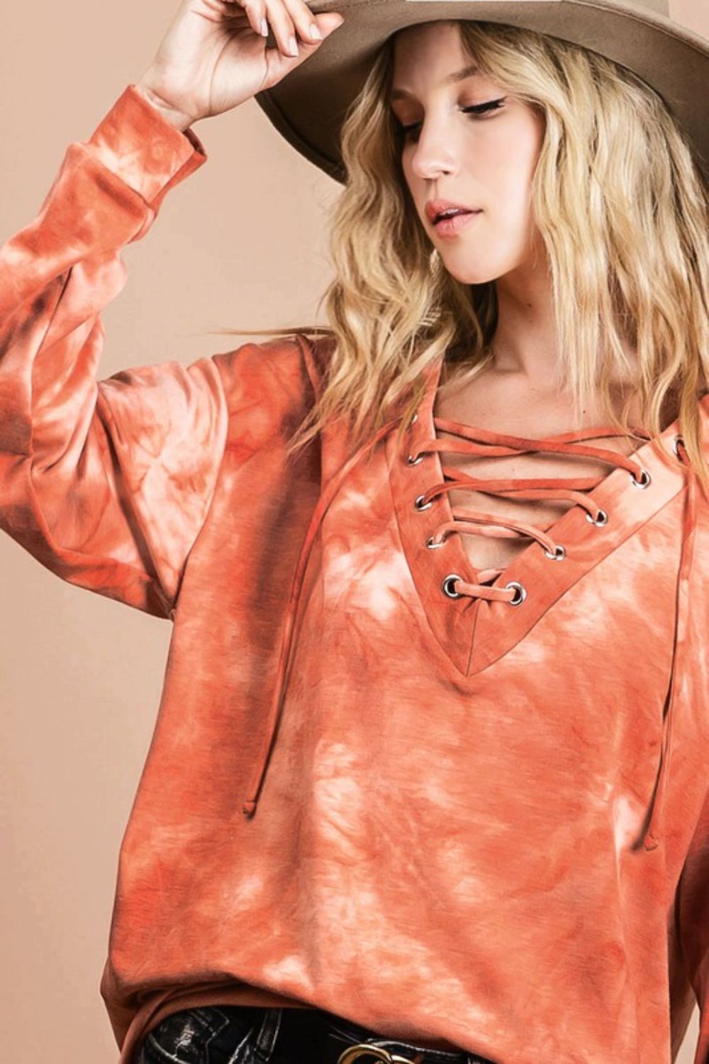 Trendy lace-up tie-dye French terry long sleeve top, perfect for casual and cozy wear.