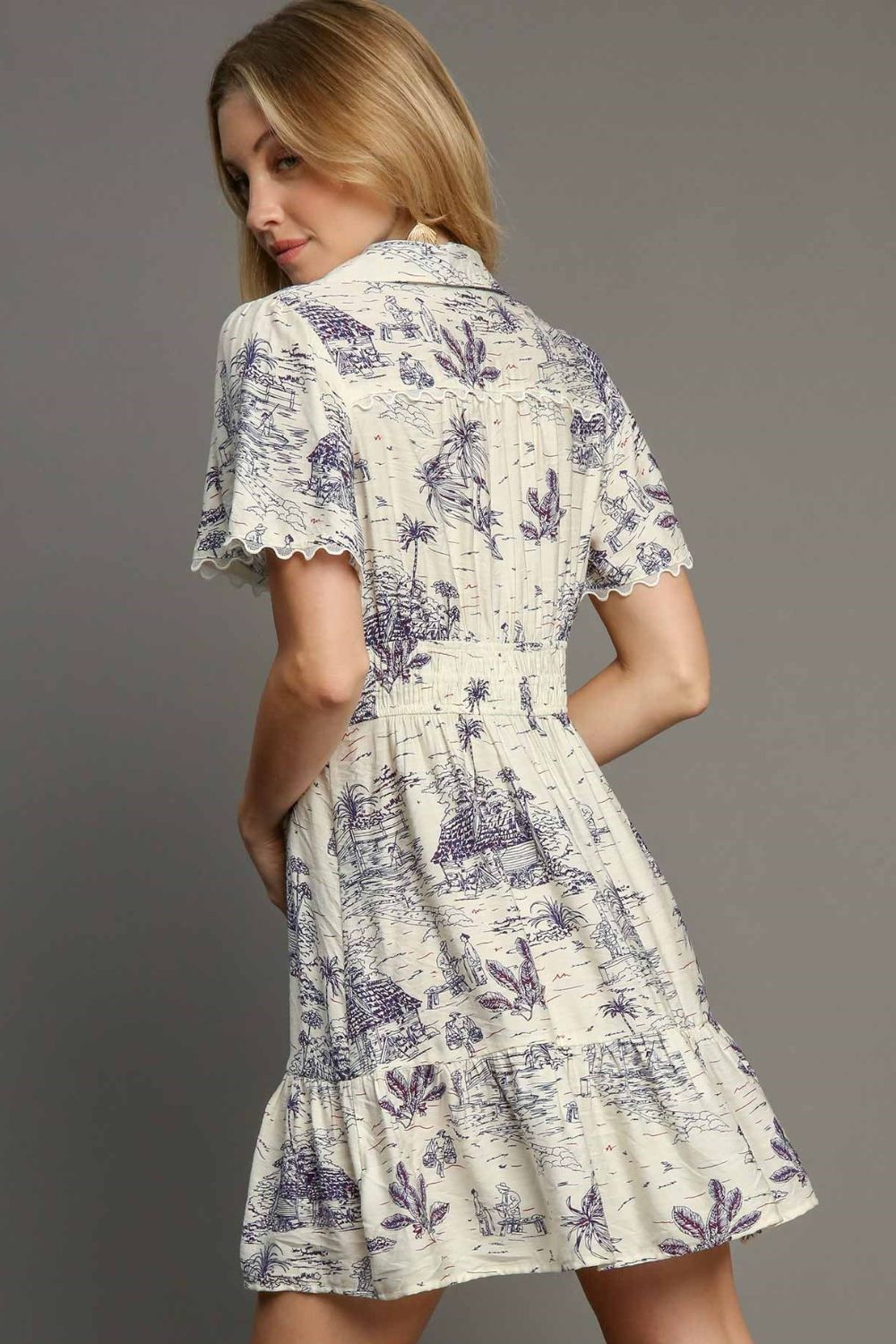 Chic landscape print collared mini dress with a sophisticated yet playful design.