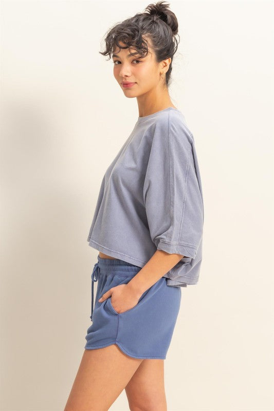 Lightweight batwing sleeve t-shirt with a round neckline, offering a relaxed fit and breathable fabric for all-day comfort.