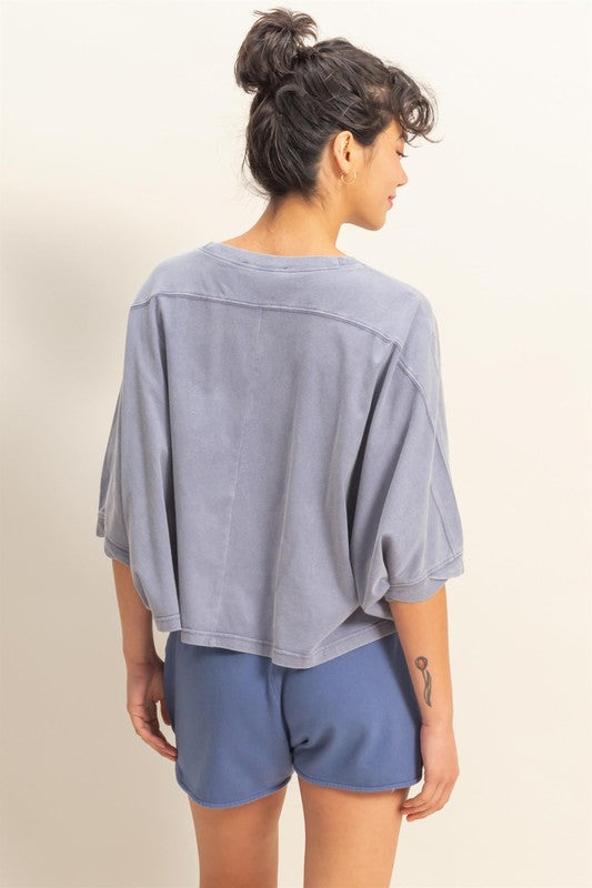 Lightweight batwing sleeve t-shirt with a round neckline, offering a relaxed fit and breathable fabric for all-day comfort.