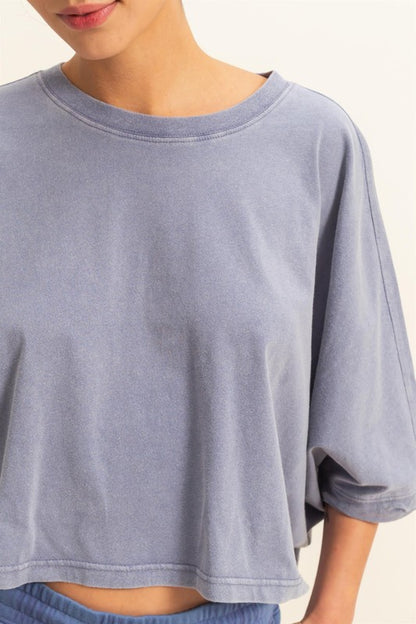 Lightweight batwing sleeve t-shirt with a round neckline, offering a relaxed fit and breathable fabric for all-day comfort.