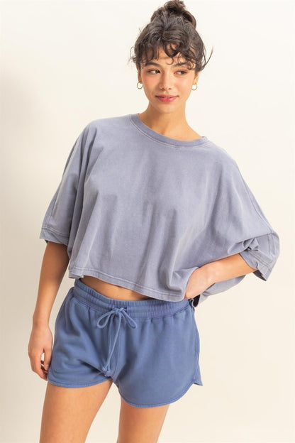 Lightweight batwing sleeve t-shirt with a round neckline, offering a relaxed fit and breathable fabric for all-day comfort.