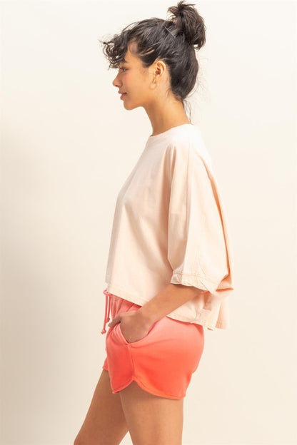 A lightweight batwing sleeve t-shirt with a round neck, perfect for effortless styling.