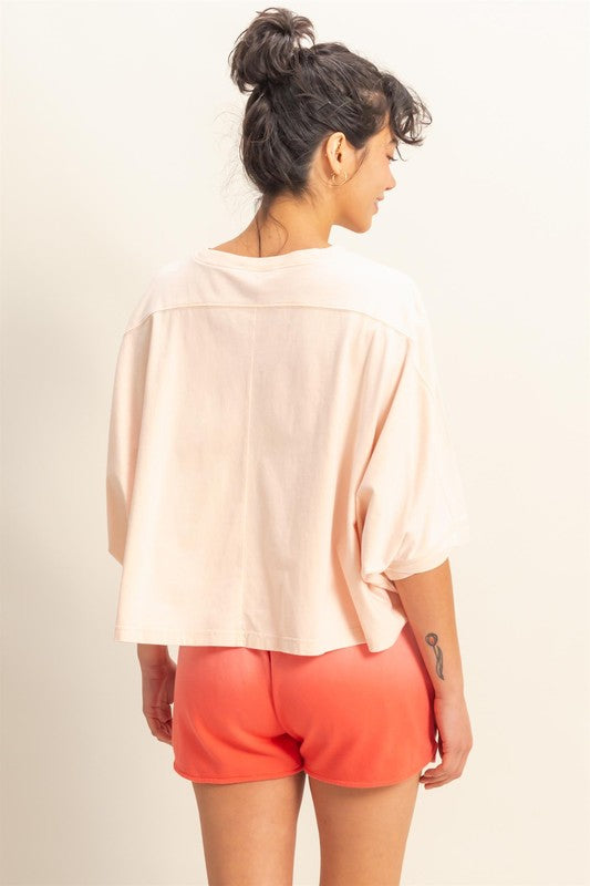 A lightweight batwing sleeve t-shirt with a round neck, perfect for effortless styling.