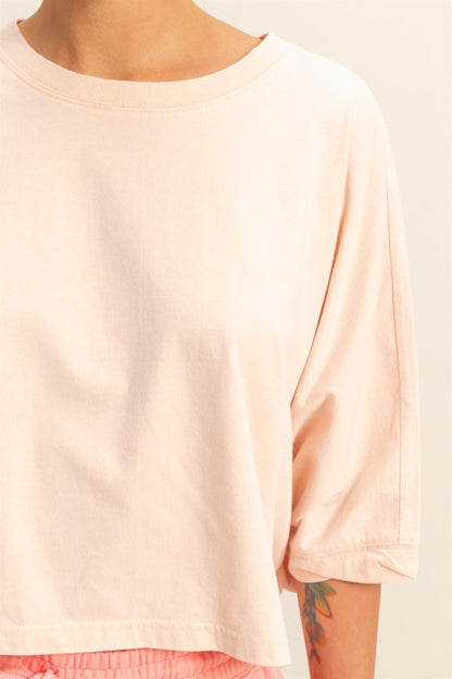 A lightweight batwing sleeve t-shirt with a round neck, perfect for effortless styling.