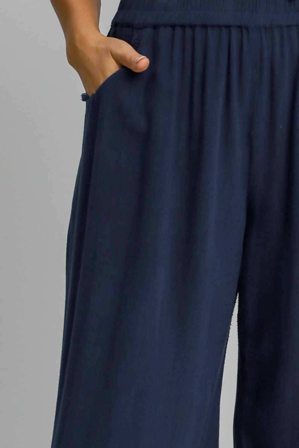 Lightweight linen blend wide-leg pants with an elastic waistband, designed for a relaxed and stylish look.