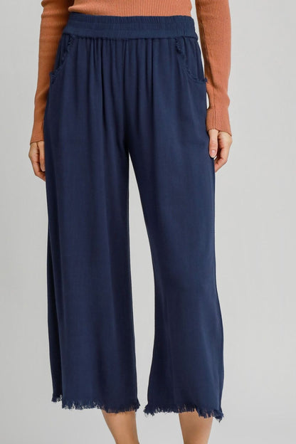 Lightweight linen blend wide-leg pants with an elastic waistband, designed for a relaxed and stylish look.