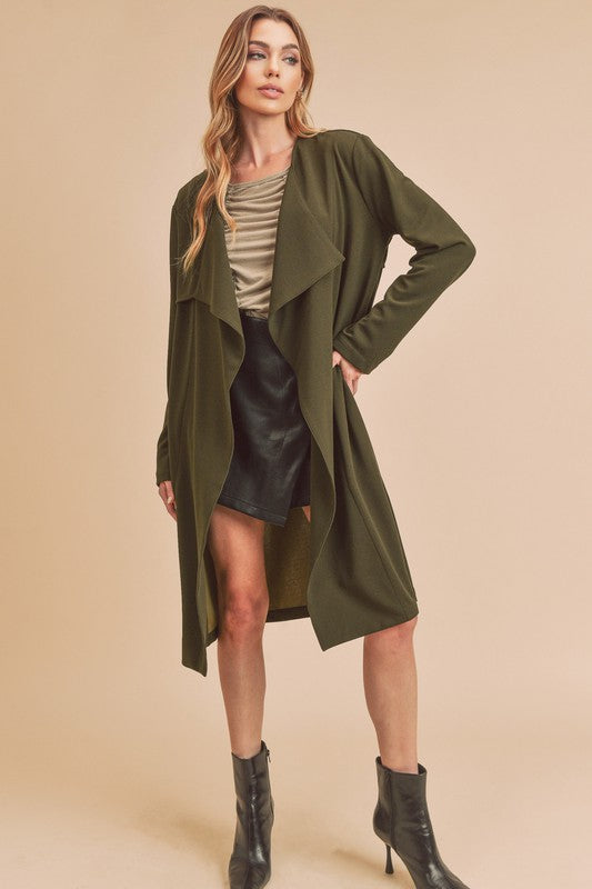 Chic open-front longline coat with long sleeves and pockets, perfect for layering.