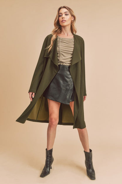 Chic open-front longline coat with long sleeves and pockets, perfect for layering.